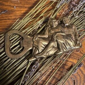 Vintage Cast Gemini zodiac bottle opener, marked "MOD. DEP." barware